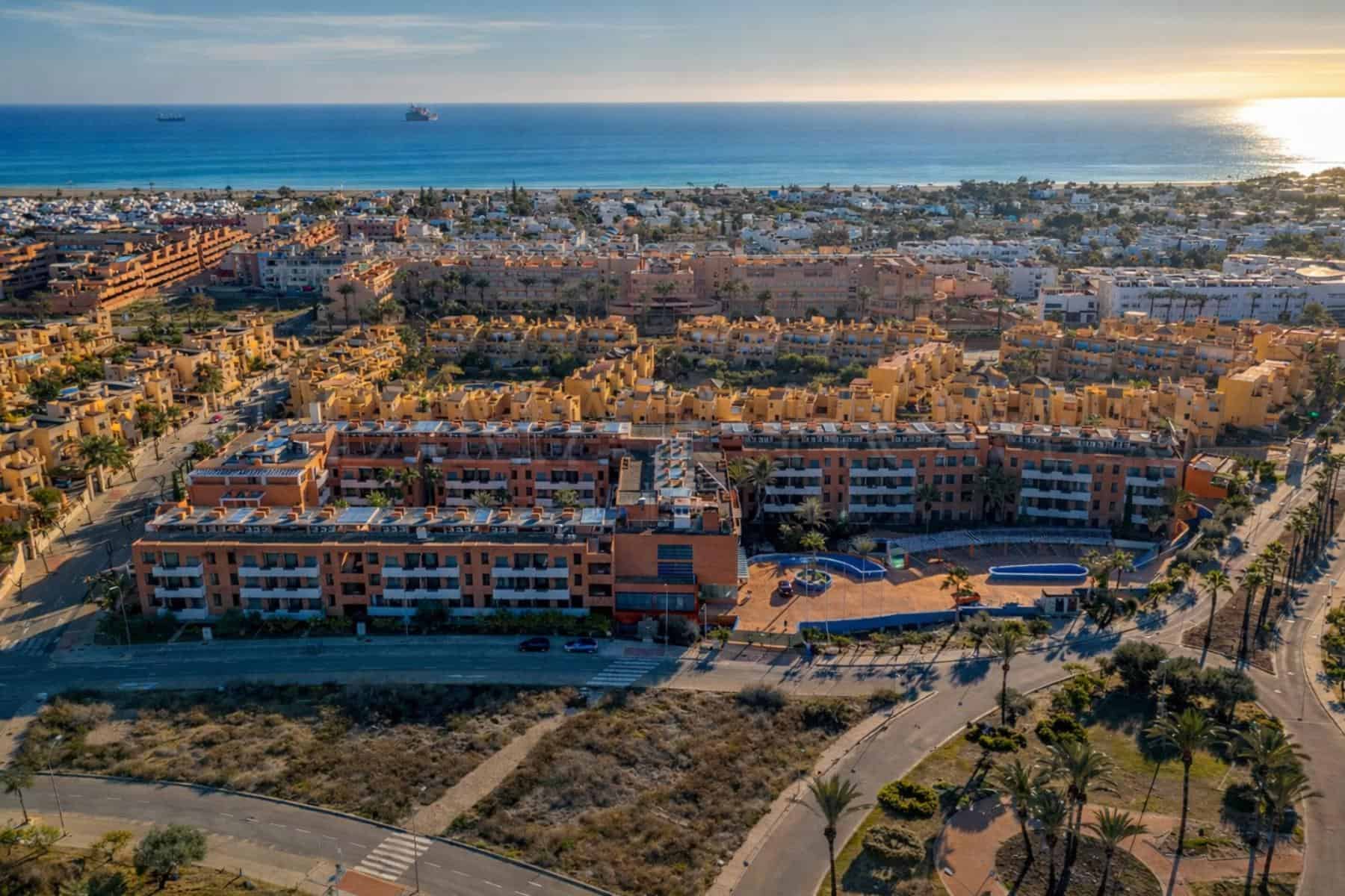 Mediterranean sunset over coastal complex